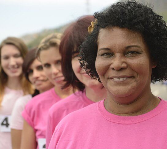Image showing a group of ladies standing in a queue with pink tshirts