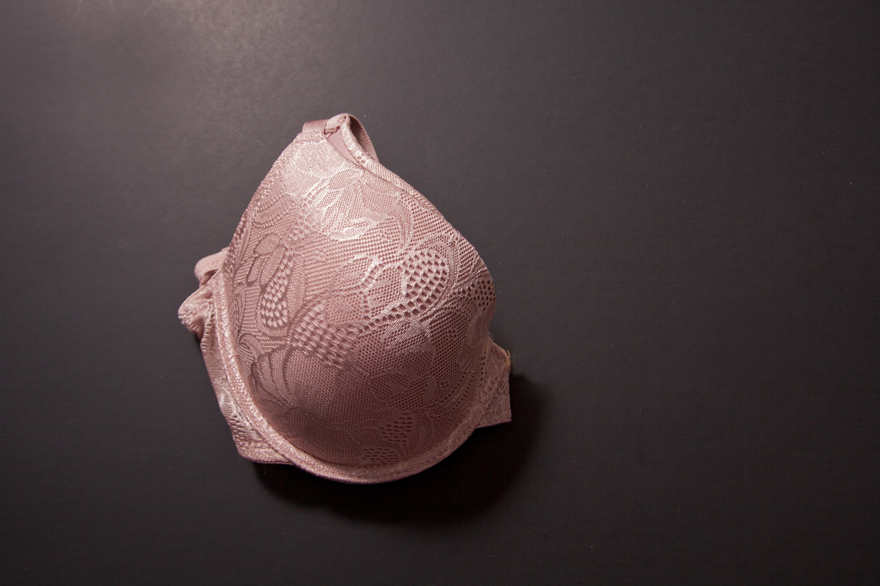 One half of pink bra for those wondering what to wear after a mastectomy